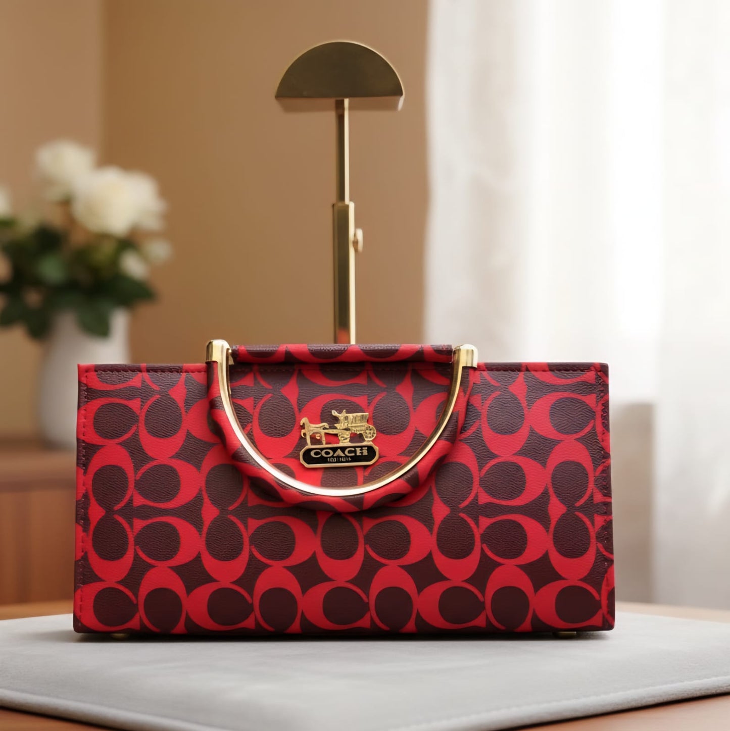 Elegant Red Coach Handbag with Signature Pattern